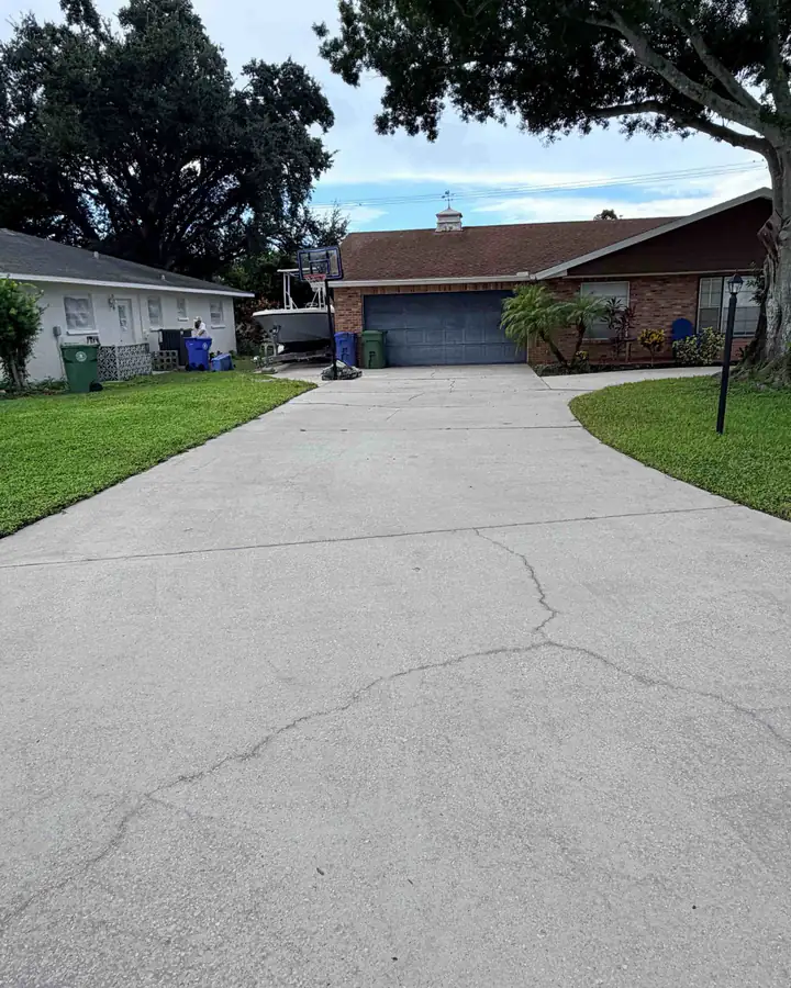 The garage end of the driveway after pressure washing: clean, light concrete